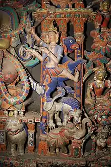 Detail of painted stucco images in the shrine